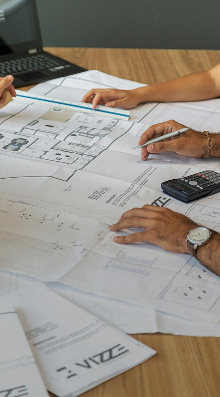 Project timeline and budget planning on desk with construction tools