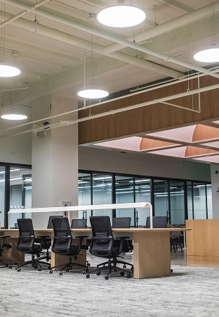 Completed office interior with finished ceilings, lighting and furniture